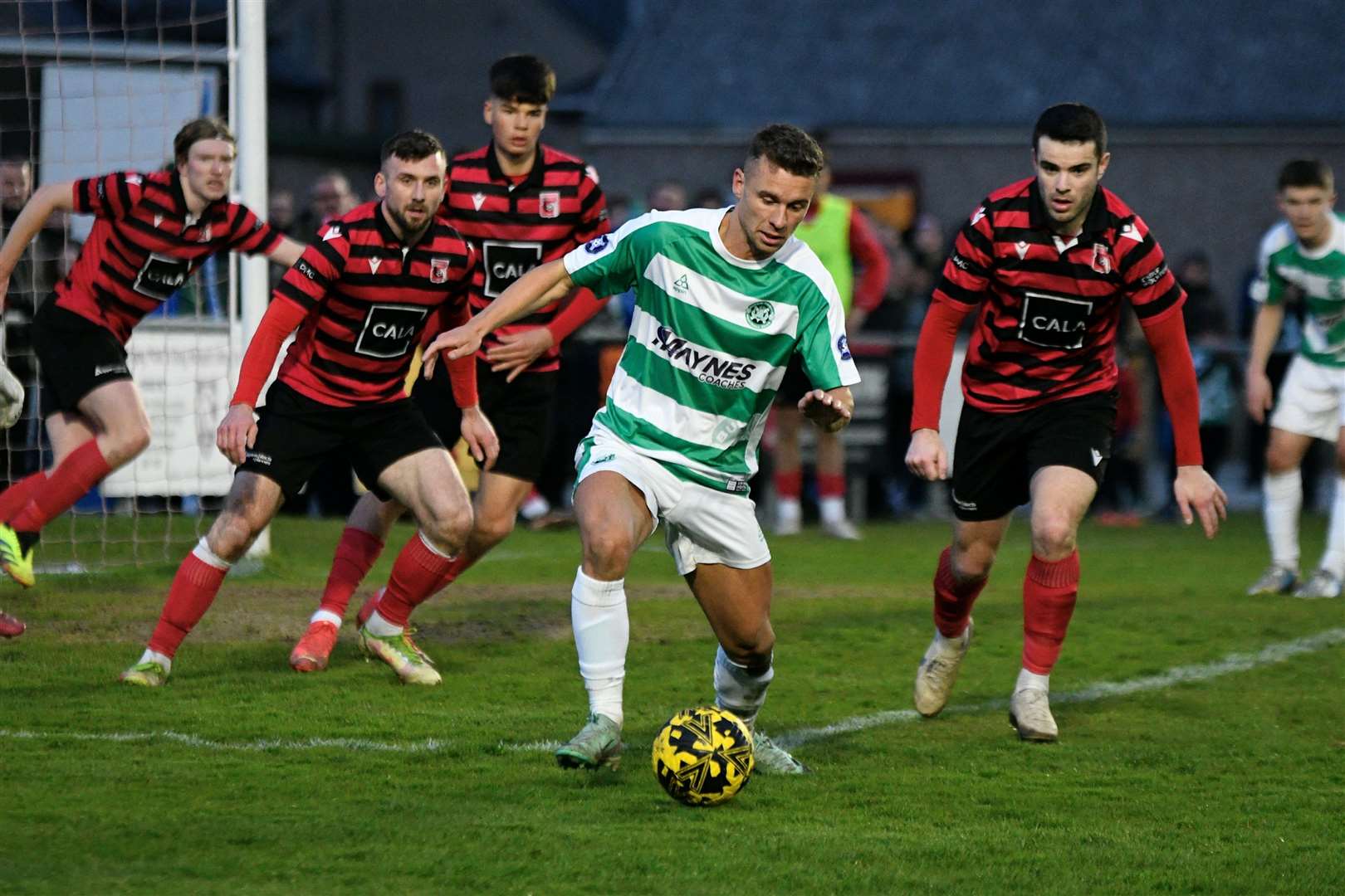 Four Locos players have their eyes on Buckie's Scott Adams. Picture: Daniel Forsyth