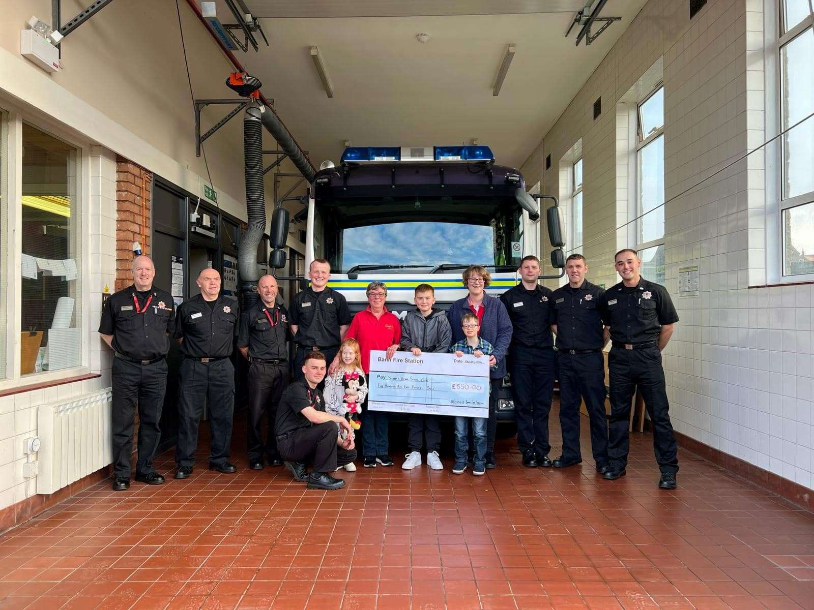 Banff Fire Station presented a donation to Scooby's After School Club.