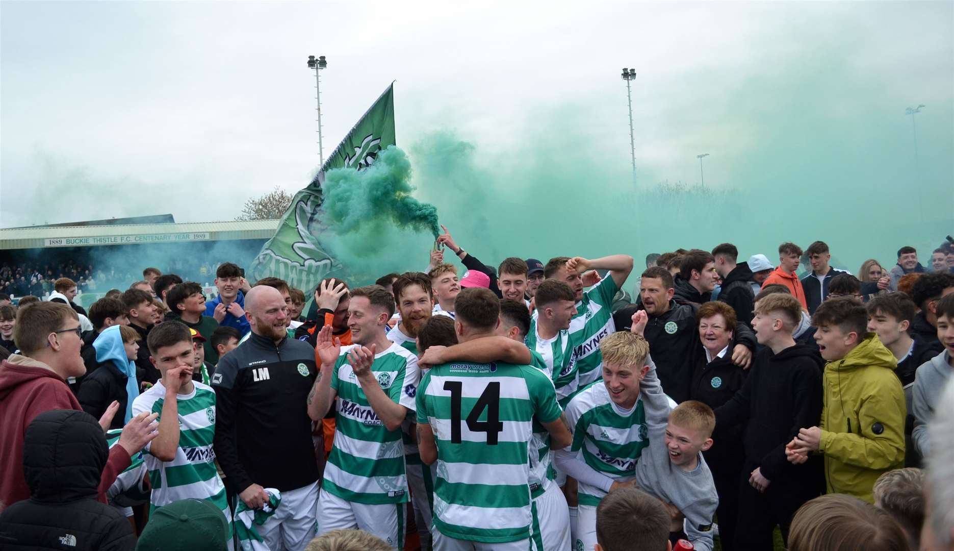 Buckie Thistle players are swarmed on the pitch by delighted supporters. Picture: Tyler McNeill