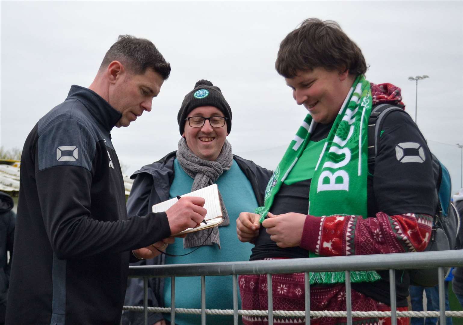 Buckie Thistle manager Graeme Stewart signs autographs after leading the Jags to the Highland League title. Picture: Tyler McNeill